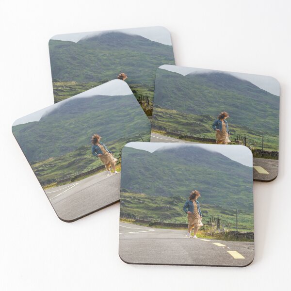 Item preview, A happy young woman wearing a dress and a blue denim jacket running along a road in Killarney National Park, Ring of Kerry, near the town of Killarney in County Kerry, Ireland. designed and sold by AlbertMi.