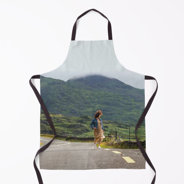 Item preview, A happy young woman wearing a dress and a blue denim jacket running along a road in Killarney National Park, Ring of Kerry, near the town of Killarney in County Kerry, Ireland. designed and sold by AlbertMi.