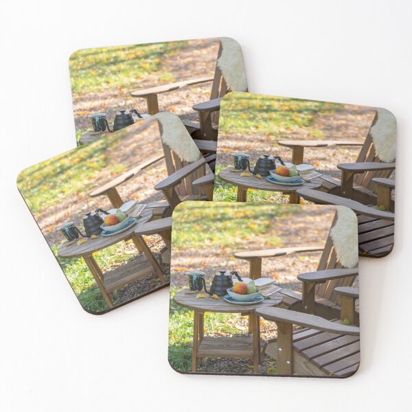 Item preview, An open book, a kettle with a cup of tea, a plate with apples and pears, on a wooden table with comfortable armchair beside, outdoor in autumn. designed and sold by AlbertMi.