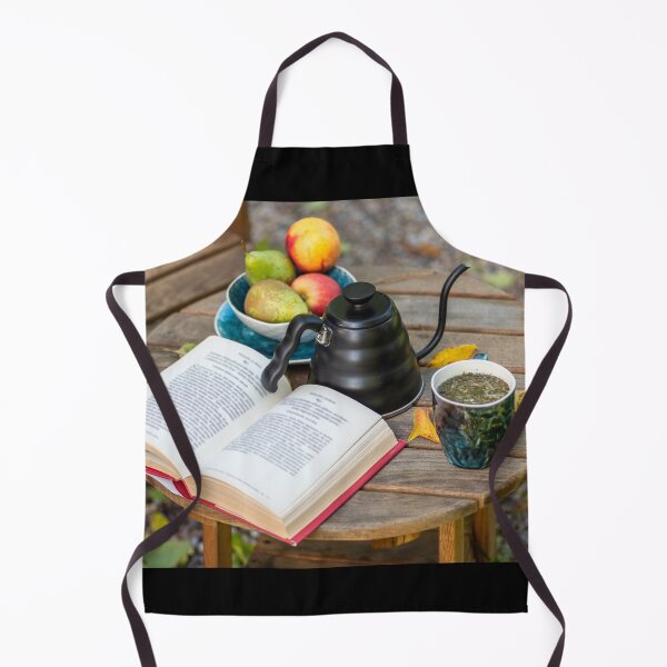 Item preview, An open book, a kettle with a cup of tea, a plate with apples and pears, on a wooden table with comfortable armchair beside, outdoor in autumn. designed and sold by AlbertMi.