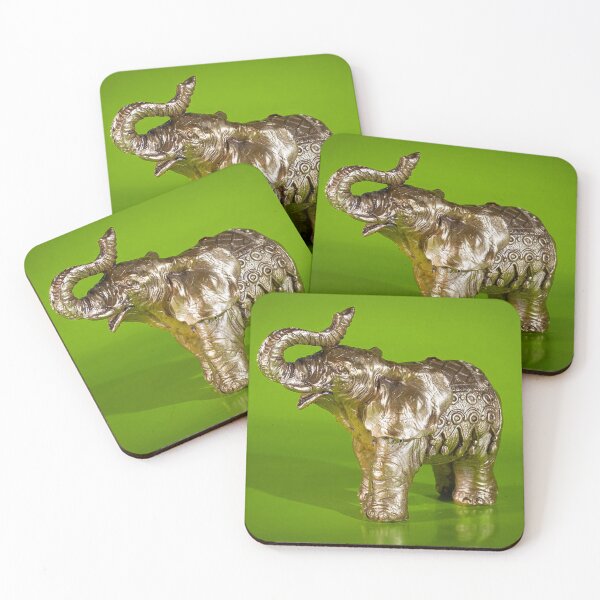 Item preview, Golden elephant figurine against a green backdrop. designed and sold by claireseyeview.