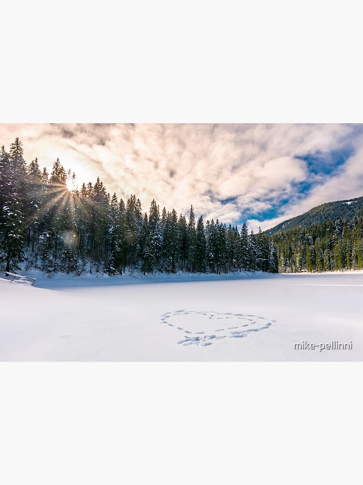 Thumbnail 3 of 3, Sticker, heart on the snow in spruce forest at sunset designed and sold by mike-pellinni.