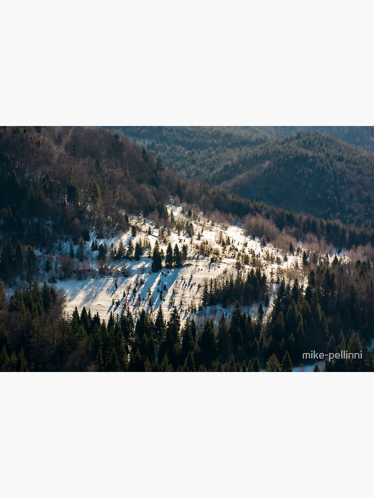 Thumbnail 3 of 3, Sticker, snow covered meadow among forest on hillside designed and sold by mike-pellinni.