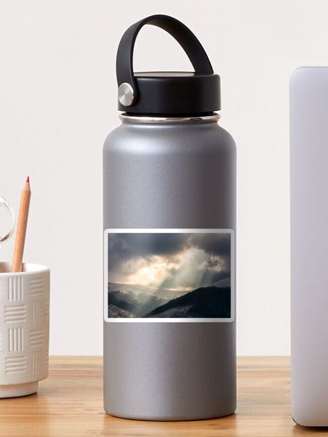 Thumbnail 1 of 3, Sticker, beams of light over the mountains designed and sold by mike-pellinni.