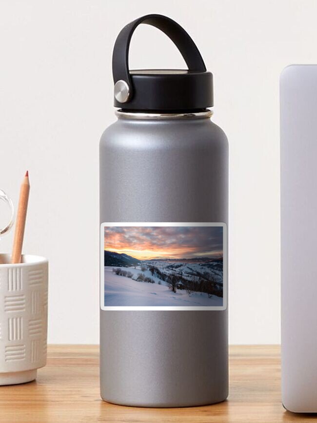 Thumbnail 1 of 3, Sticker, winter dawn in mountainous countryside designed and sold by mike-pellinni.