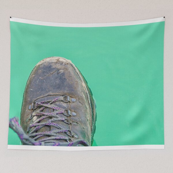 Item preview, Hiking boot hanging over turquoise water designed and sold by Photopat.