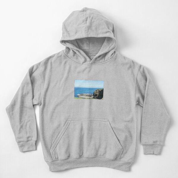 Rocks and raised ledge in sea Kids Pullover Hoodie