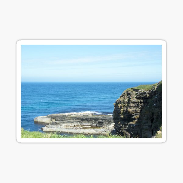 Rocks and raised ledge in sea Sticker