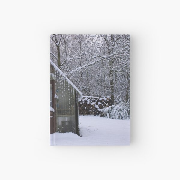 Greenhouse on a snowy day Hardcover Journal