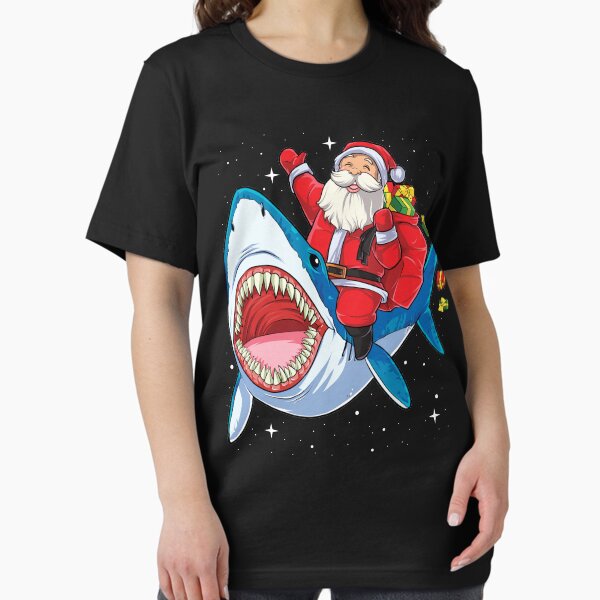 Item preview, Santa Riding Shark T Shirt Christmas Gifts Galaxy Space Tees designed and sold by LiqueGifts.