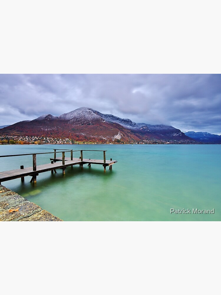 Autumn snow over the lake in Annecy by patmo