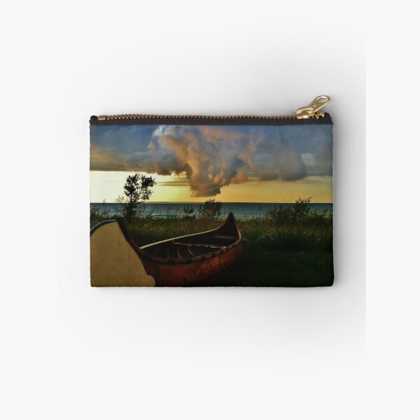 Item preview, Canoe at Lake Edge with Dramatic Clouds designed and sold by Nalinne Jones.