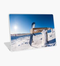 Snowboard leaning on a wood rail Laptop Skin