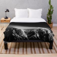 Black and white long exposure of clouds above mountain Throw Blanket