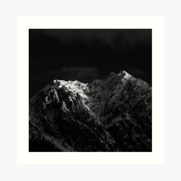 Sunlight hitting the mountains black and white Art Print