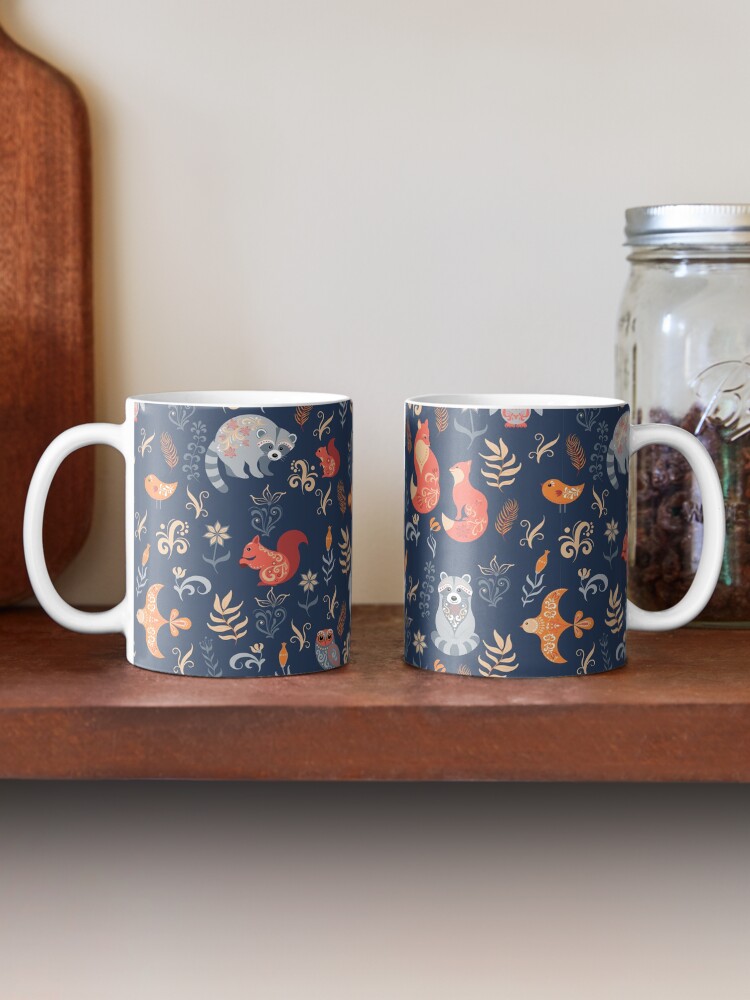 Alternate view of Fairy-tale forest. Fox, bear, raccoon, owls, rabbits, flowers and herbs on a blue background. Mug