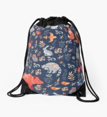 Fairy-tale forest. Fox, bear, raccoon, owls, rabbits, flowers and herbs on a blue background. Drawstring Bag