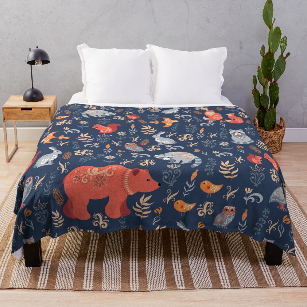 Fairy-tale forest. Fox, bear, raccoon, owls, rabbits, flowers and herbs on a blue background. Throw Blanket