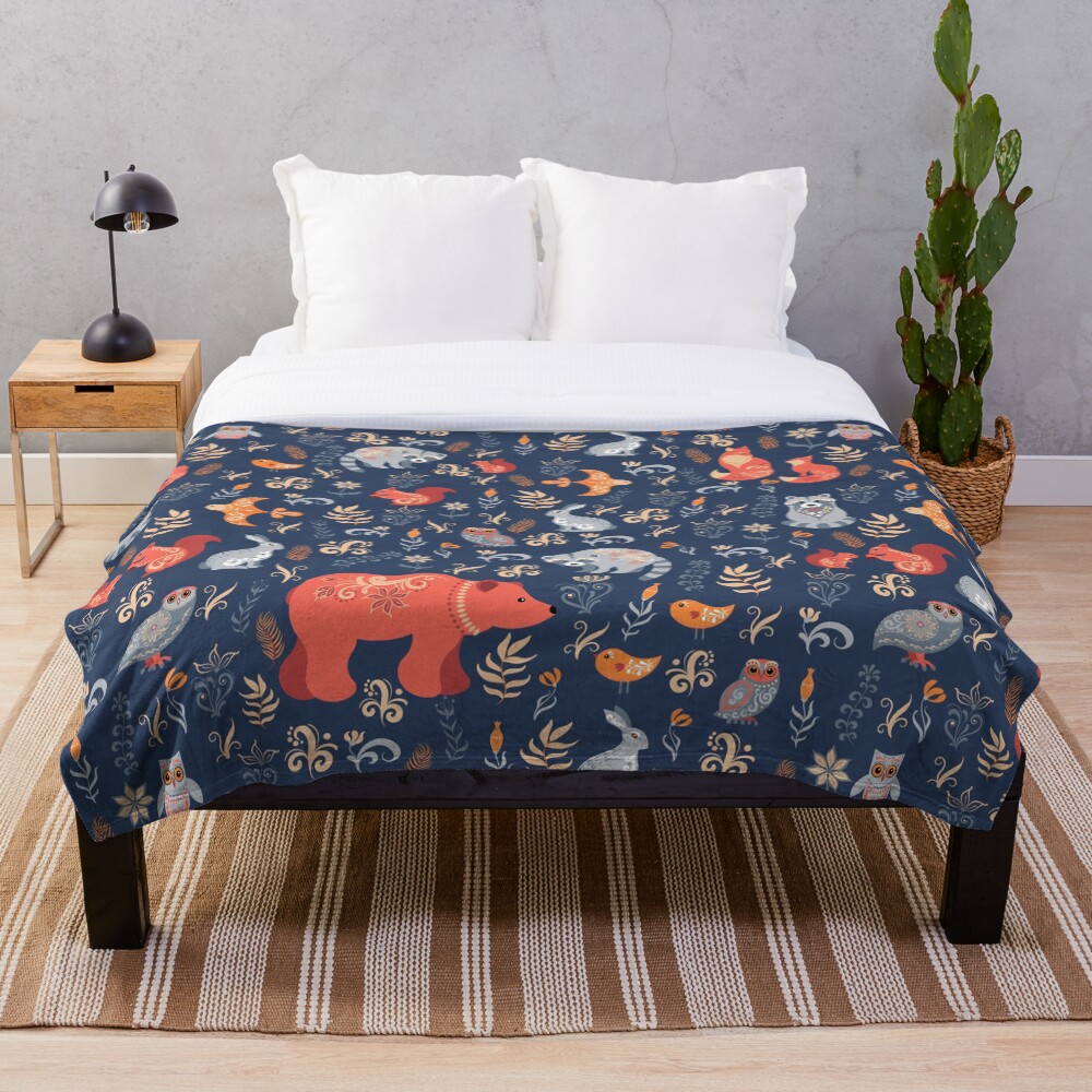 Fairy-tale forest. Fox, bear, raccoon, owls, rabbits, flowers and herbs on a blue background. Throw Blanket