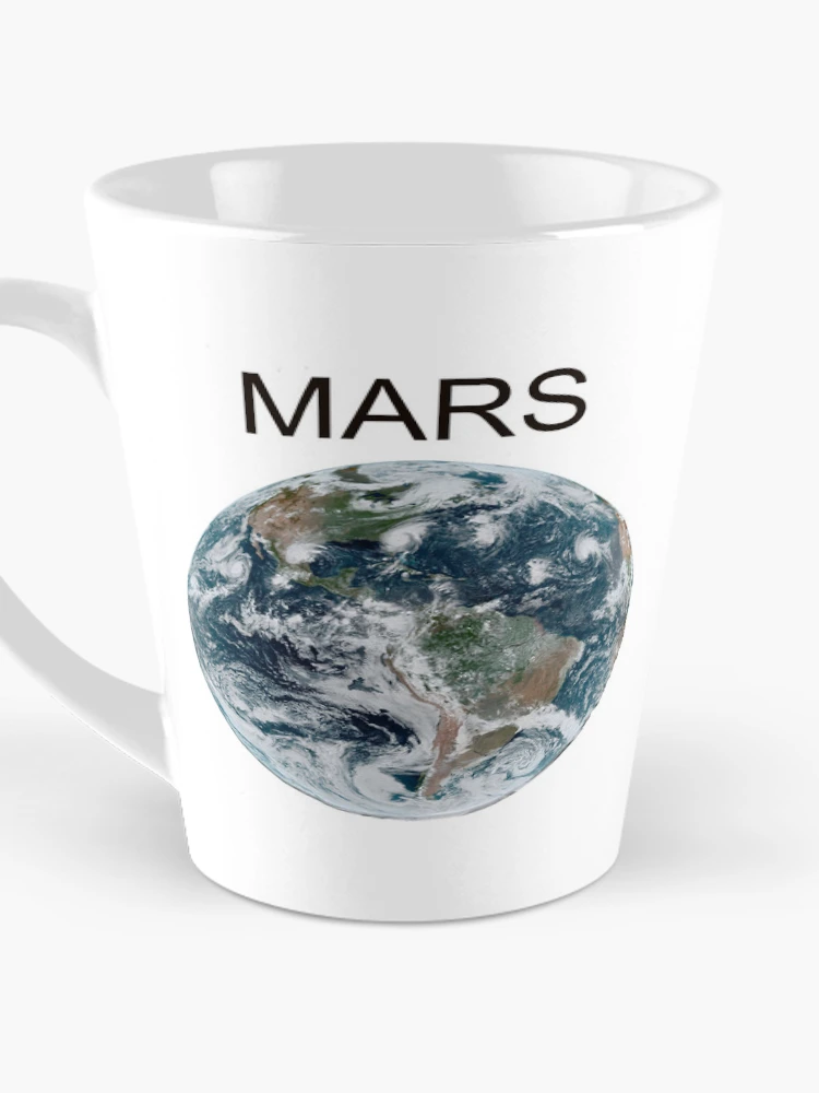 Imagen 3 de 4, Taza de café con la obra Definitivamente Marte, diseñada y vendida por PyroPython.