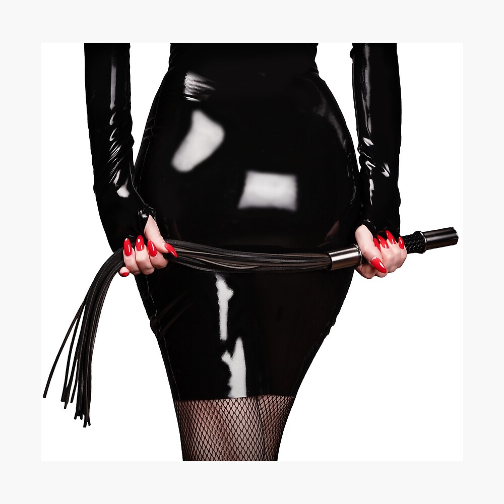 Booty of Dominant Woman in Black Latex Holding Whip