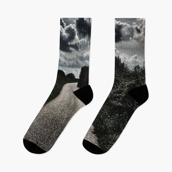 Item preview, Scenic view of dramatic dark sky above winding road less traveled  designed and sold by Khala.