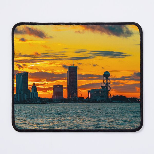 Item preview, Seaside city Batumi and sunset. Silhouettes of buildings and cloudy sky designed and sold by KGPhotoArt.