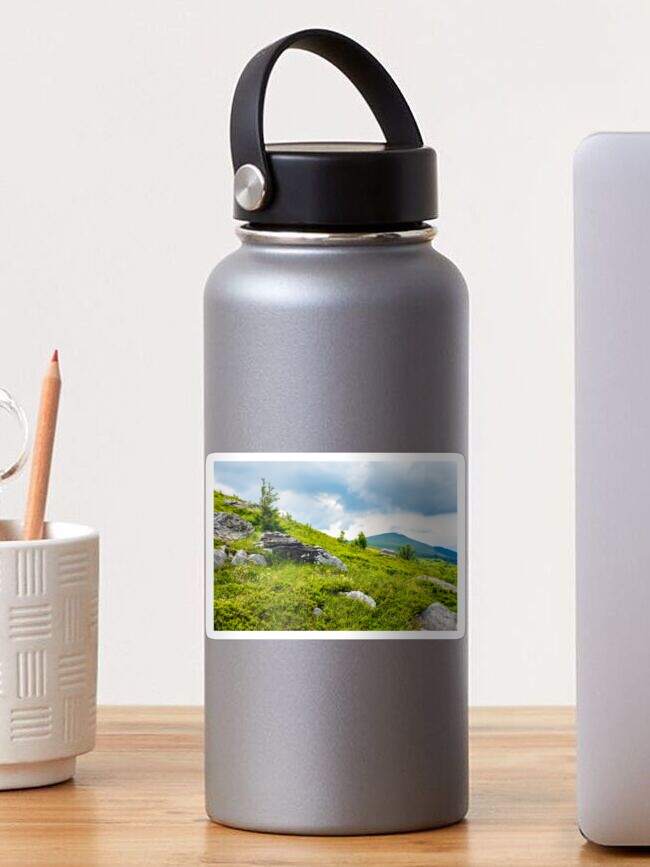 Thumbnail 1 of 3, Sticker, coniferous tree on a mountain top at sunrise designed and sold by mike-pellinni.