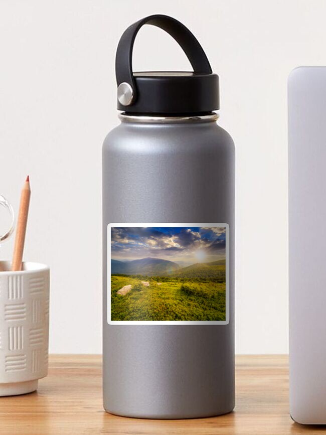 Thumbnail 1 of 3, Sticker, hill with white boulders in mountains at sunset designed and sold by mike-pellinni.