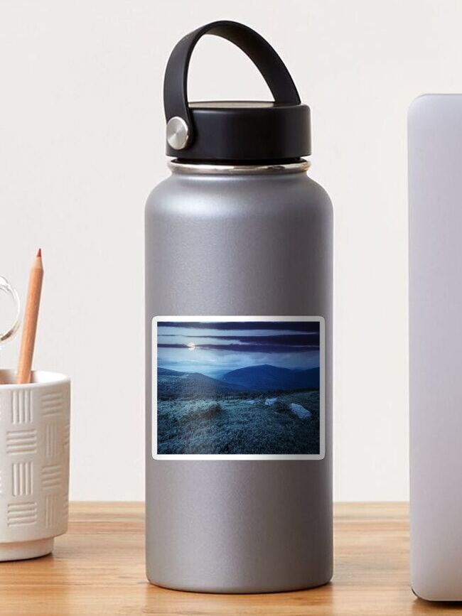 Thumbnail 1 of 3, Sticker, hill with white boulders in mountains at night designed and sold by mike-pellinni.