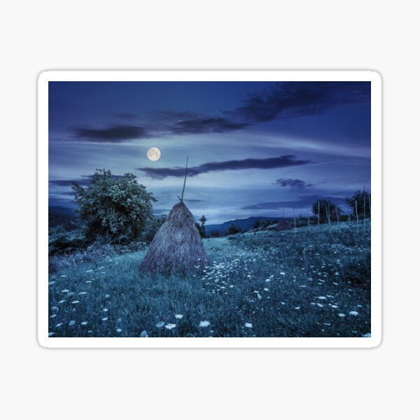 field with haystacks on hillside at night Sticker