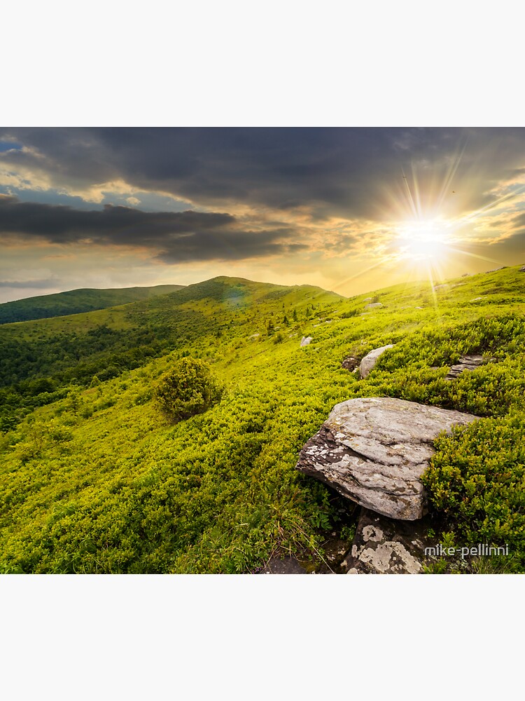 Thumbnail 3 of 3, Sticker, stones in valley on top of mountain range at sunset designed and sold by mike-pellinni.