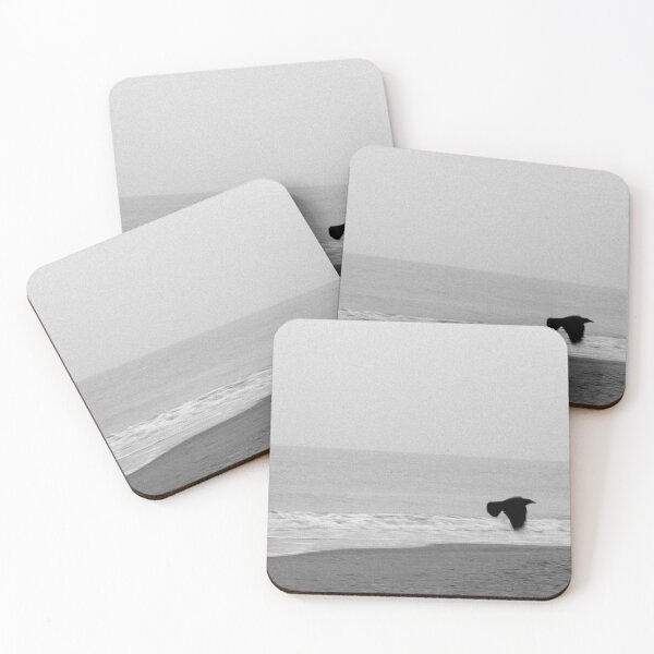 Item preview, Black and white photograph of sea and beach and a black flying bird  designed and sold by Lisa Jureczko.