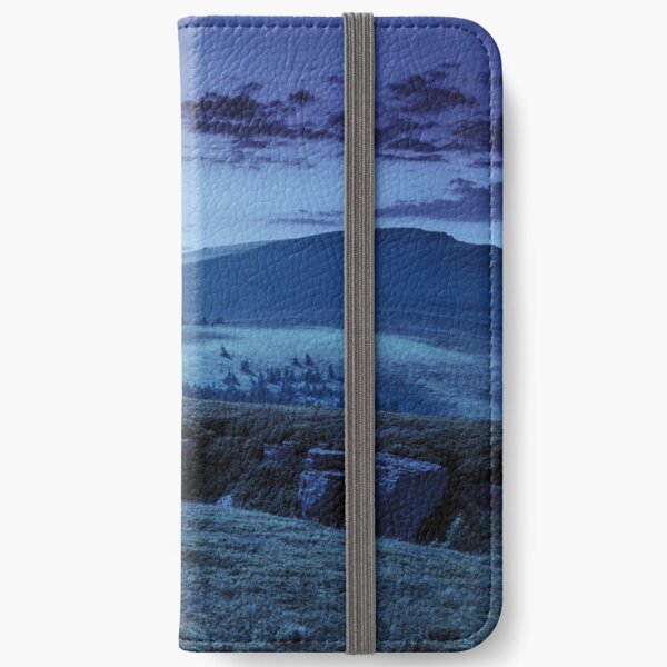 mountain peak behind hillside with boulders at night iPhone Wallet