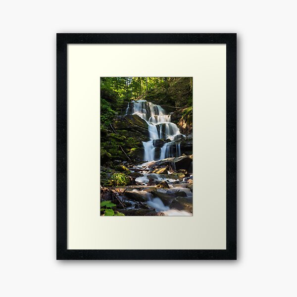 big waterfall in green forest Framed Art Print