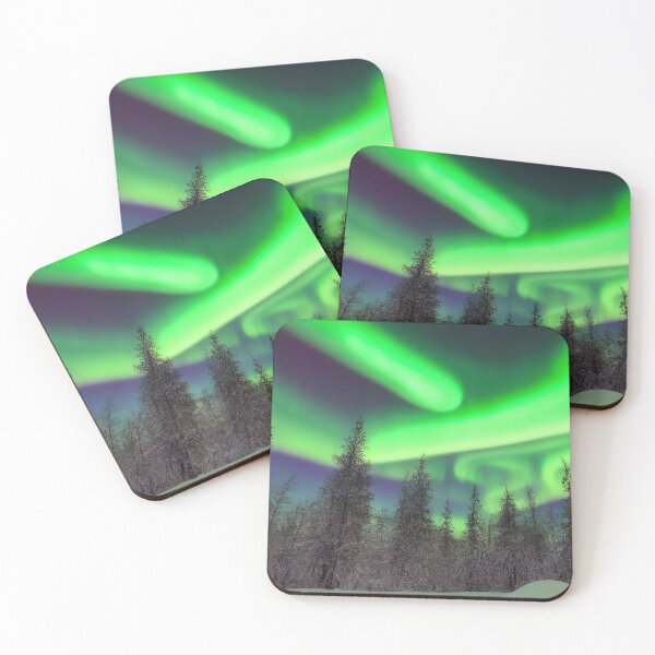 Item preview, Aurora borealis in winter trees designed and sold by pietrofoto.