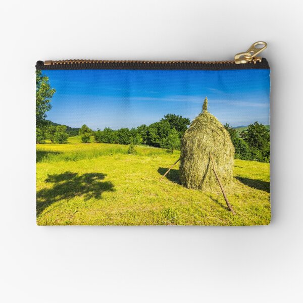 field with haystacks Zipper Pouch