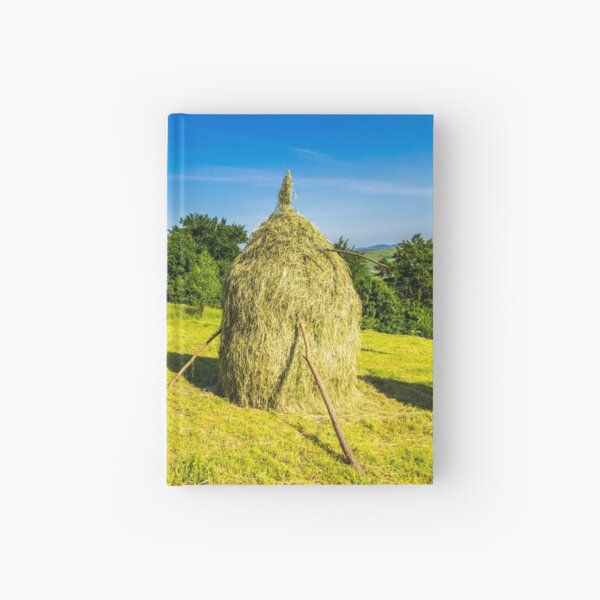 field with haystacks Hardcover Journal