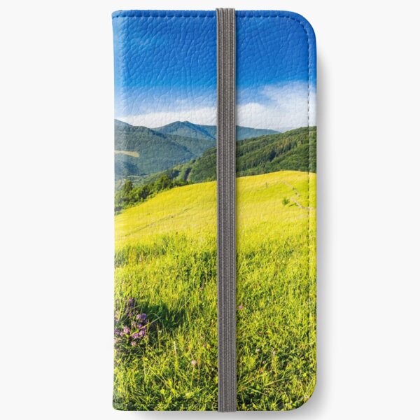 wild savory flower on hillside iPhone Wallet