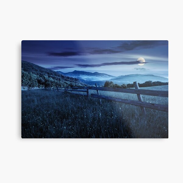 fence on hillside meadow in mountains at night Metal Print