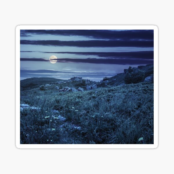 stones in valley on hillside at night Sticker