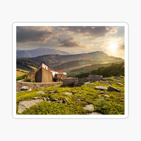 composite landscape with fortress in woods on mountain hillside at sunset Sticker