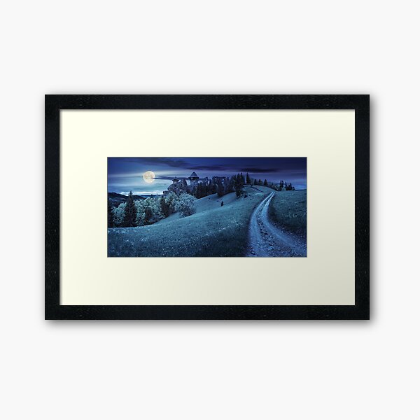 path to fortress ruins on hillside with forest at night Framed Art Print