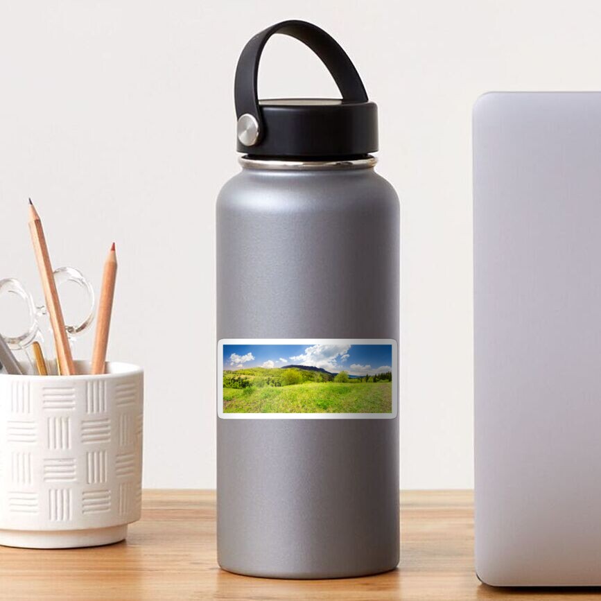 meadow near forest in mountains Sticker