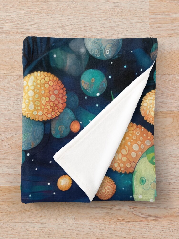 Aperçu 3 sur 6. Plaid avec l'œuvre The Universe's Embrace créée et vendue par SeedDesign.