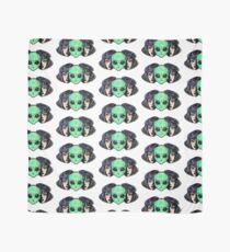 Colorful vibrant portrait of an alien from outer space face in disguise as human girl. Scarf