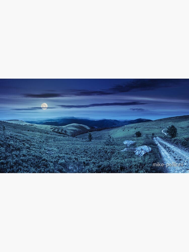 Thumbnail 3 of 3, Sticker, road on hillside meadow in mountain panorama at night designed and sold by mike-pellinni.