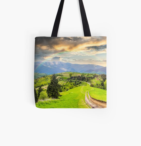 road through the meadow on hillside All Over Print Tote Bag