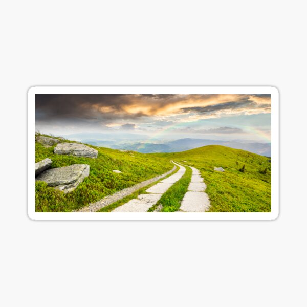 road on a hillside near mountain peak Sticker