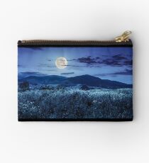 meadow with flowers in mountains at night Studio Pouch